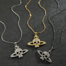 SKULL CROSS SATURN NECKLACE