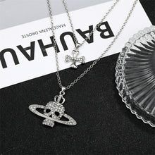 SKULL CROSS SATURN NECKLACE