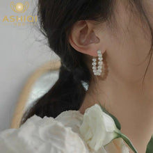 THE INFINITY PEARL HOOP EARRINGS